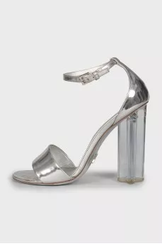 Silver sandals with a figured heel