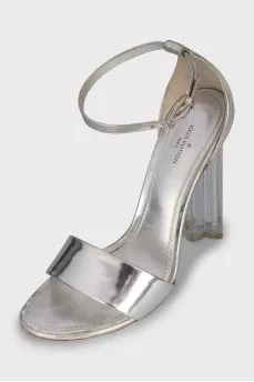 Silver sandals with a figured heel