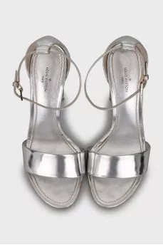 Silver sandals with a figured heel