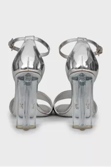 Silver sandals with a figured heel