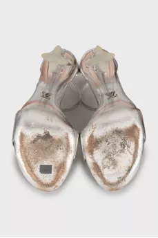 Silver sandals with a figured heel