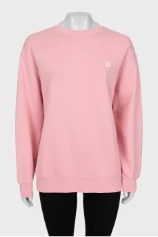 Pink sweatshirt with branded patch