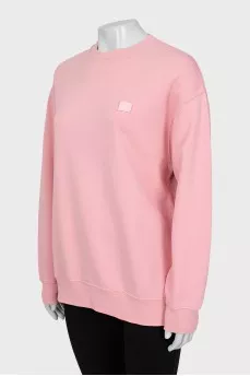Pink sweatshirt with branded patch