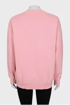Pink sweatshirt with branded patch