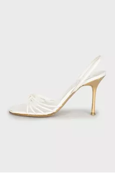 White sandals with golden heels