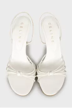 White sandals with golden heels