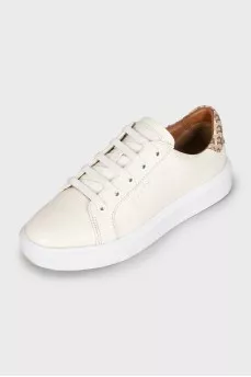 White sneakers with branded logo on the back