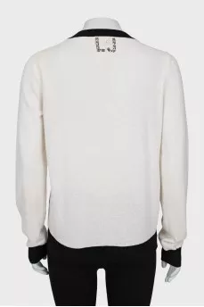 Sweater in black print with sequins
