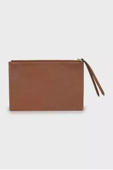 Leather and canvas clutch decorated with patches