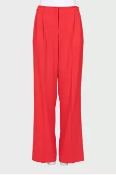Red trousers with arrows and tag