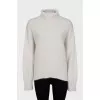 Knitted white turtleneck sweater