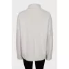 Knitted white turtleneck sweater