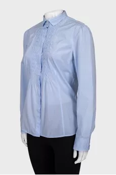 Blue shirt with decor
