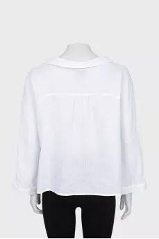 Loose fit blouse with buttons on the shoulder