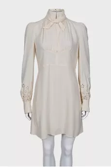 Dress with perforated sleeves