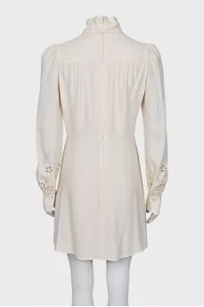 Dress with perforated sleeves