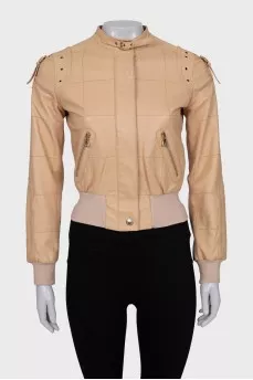 Leather jacket with buckles on the shoulders