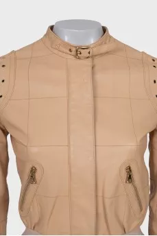 Leather jacket with buckles on the shoulders