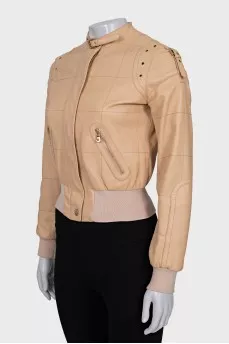 Leather jacket with buckles on the shoulders