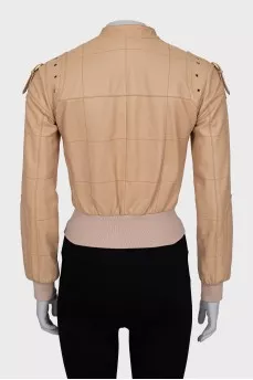 Leather jacket with buckles on the shoulders