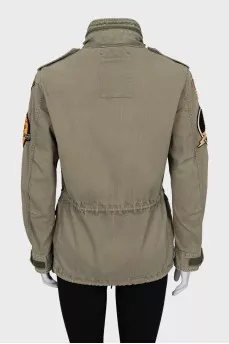 Jacket decorated with patches