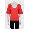 Red jumper with silk sleeves