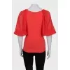 Red jumper with silk sleeves