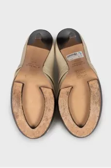 Leather shoes on a wooden platform