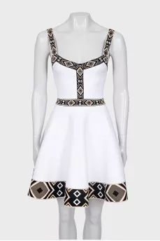 White dress with geometric pattern