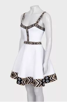 White dress with geometric pattern