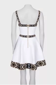White dress with geometric pattern