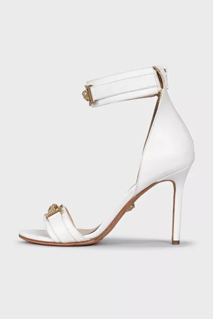 White sandals with gold decor