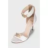 White sandals with gold decor