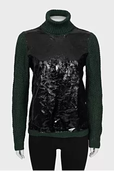 Green sweater with patent leather element