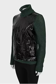 Green sweater with patent leather element