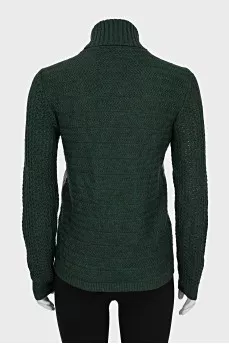 Green sweater with patent leather element