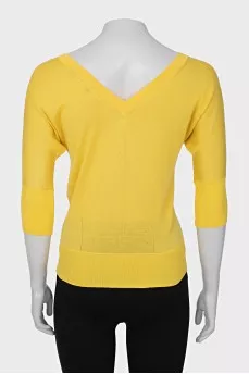 Yellow pullover with a cutout on the back