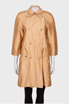 Double-breasted orange raincoat
