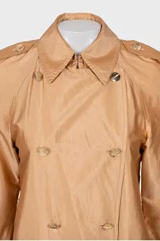 Double-breasted orange raincoat