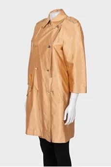 Double-breasted orange raincoat