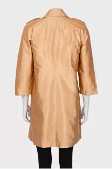 Double-breasted orange raincoat