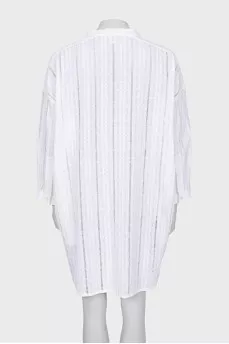 Dress with ties and perforations
