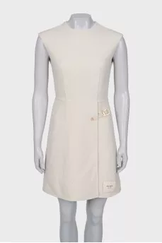 White dress with golden pin
