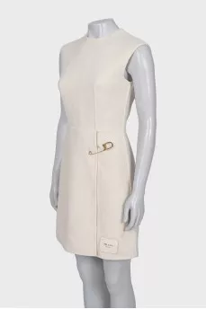 White dress with golden pin