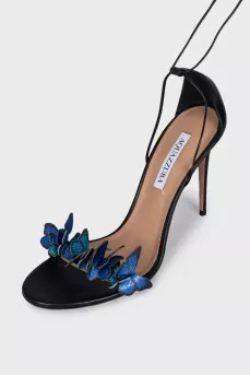 Leather sandals decorated with butterflies