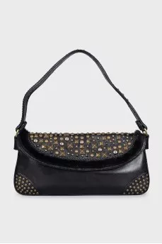 Leather bag decorated with rivets and fur