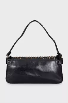 Leather bag decorated with rivets and fur