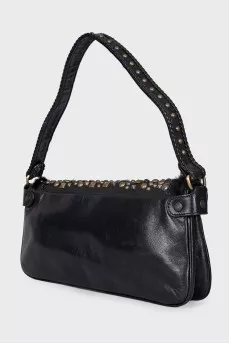 Leather bag decorated with rivets and fur