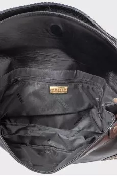 Leather bag decorated with rivets and fur
