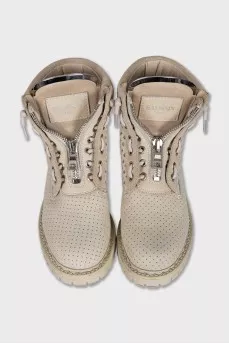 Leather lace-up boots with perforations